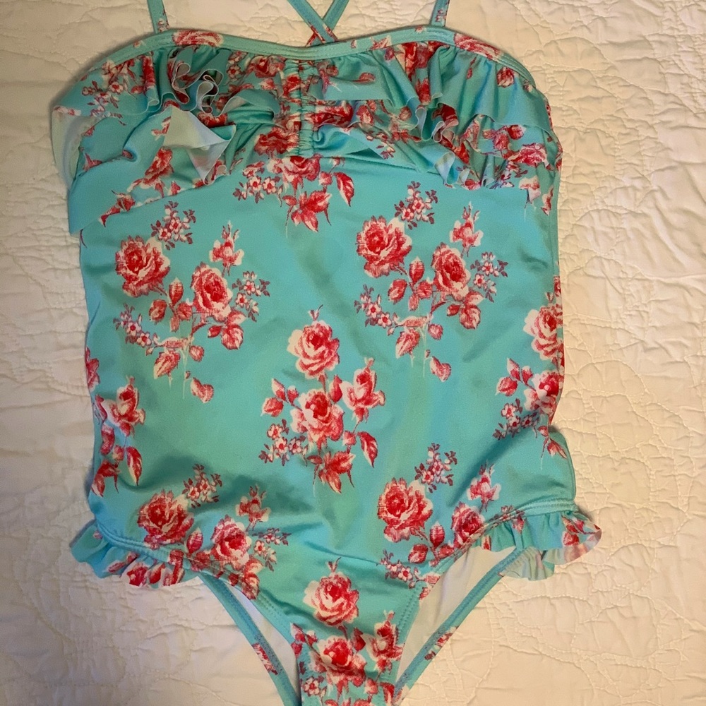 Cute teal floral suit, delicate ruffles. Liner on